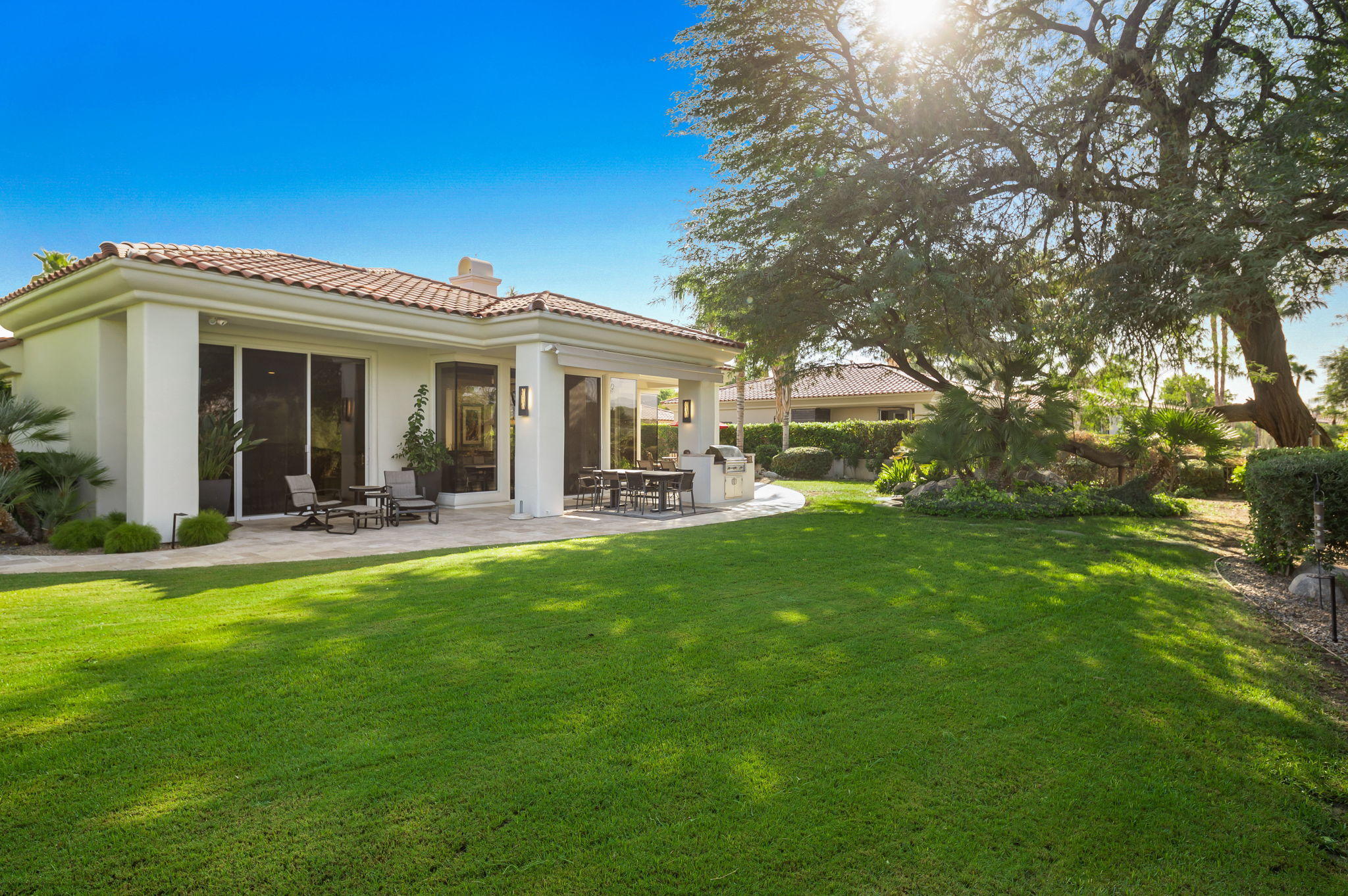 202 Loch Lomond Road Rancho Mirage, CA 92270 - Photo 45 of 47 a view of a house with a backyard porch and sitting area