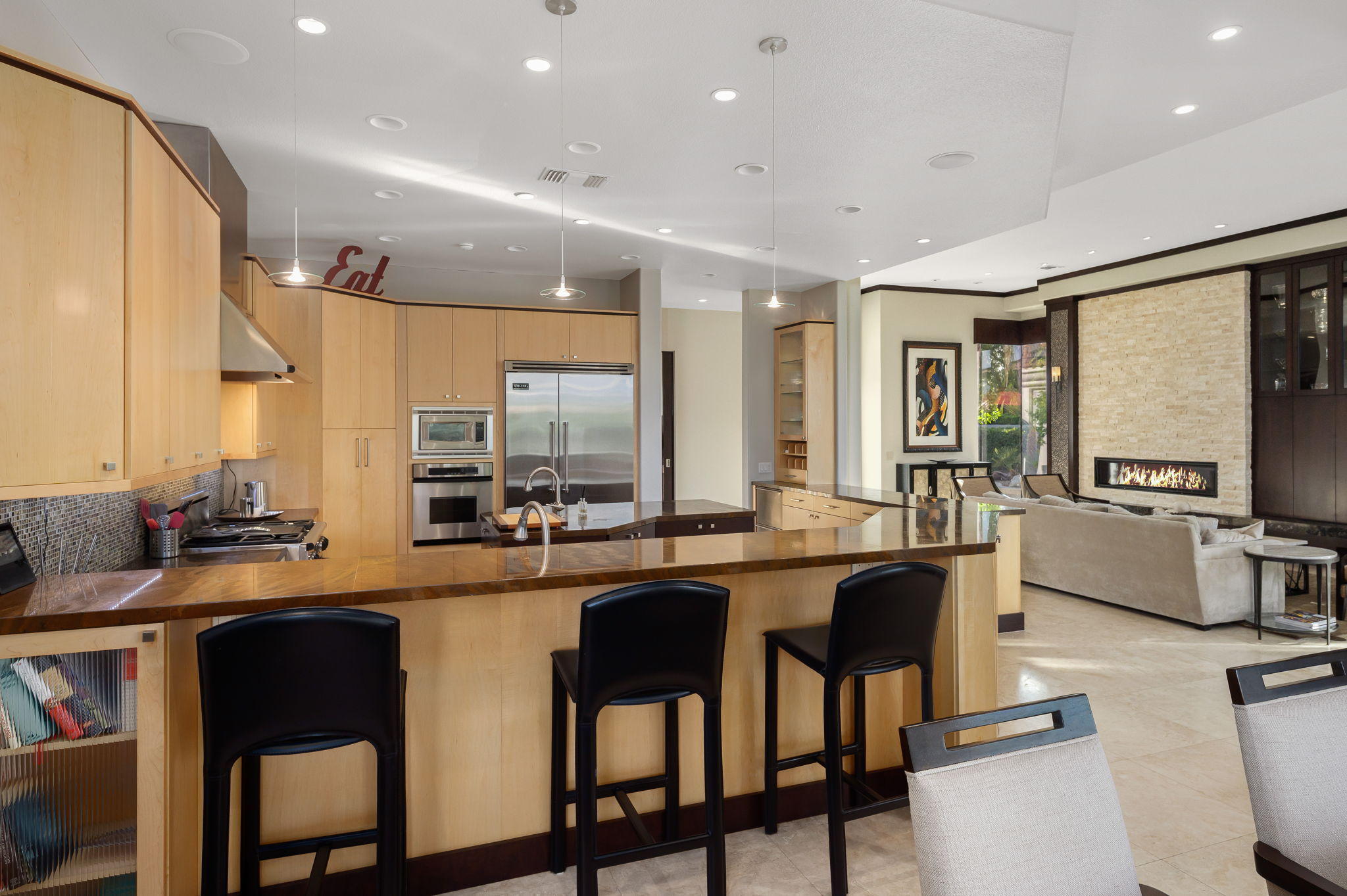 202 Loch Lomond Road Rancho Mirage, CA 92270 - Photo 10 of 47 a kitchen with lots of counter top space and dining table
