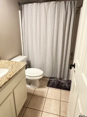 a kitchen with a sink cabinets and stainless steel appliances