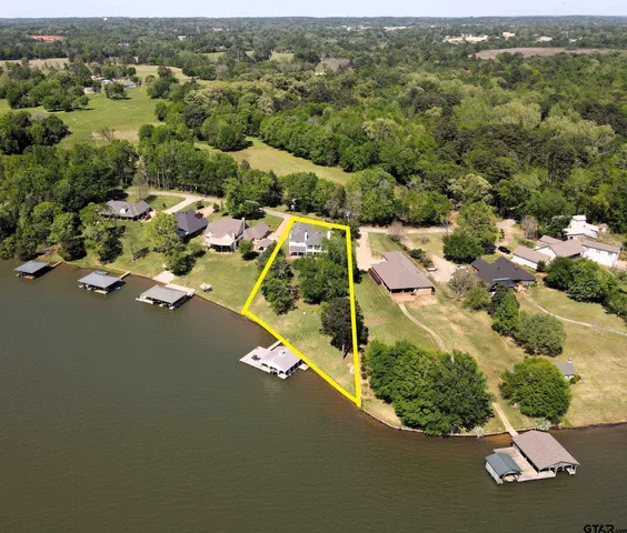 an aerial view of a house with yard swimming pool and outdoor seating