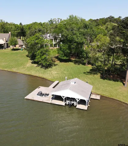 an aerial view of house with lake view