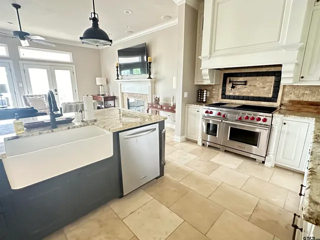 a kitchen with a stove sink and a microwave