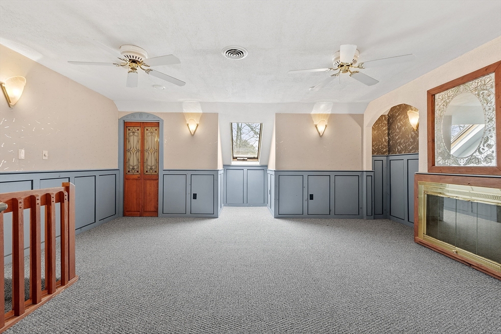 8 Deer Path, Unit 5 Maynard, MA 01754 - Photo 13 of 25 an empty room with fan and windows