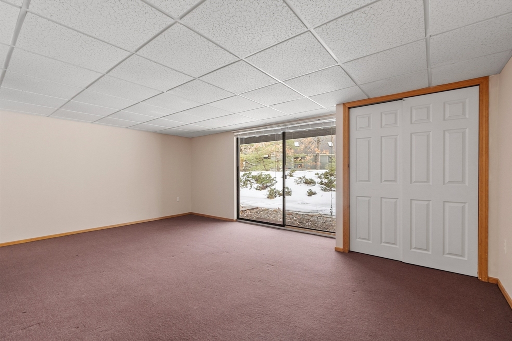 8 Deer Path, Unit 5 Maynard, MA 01754 - Photo 16 of 25 a view of an empty room with a window