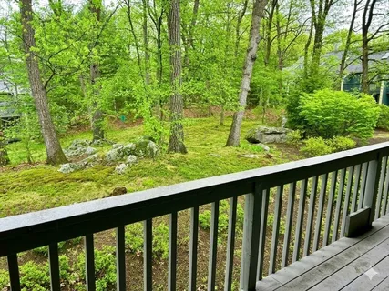 a view of a garden from a balcony