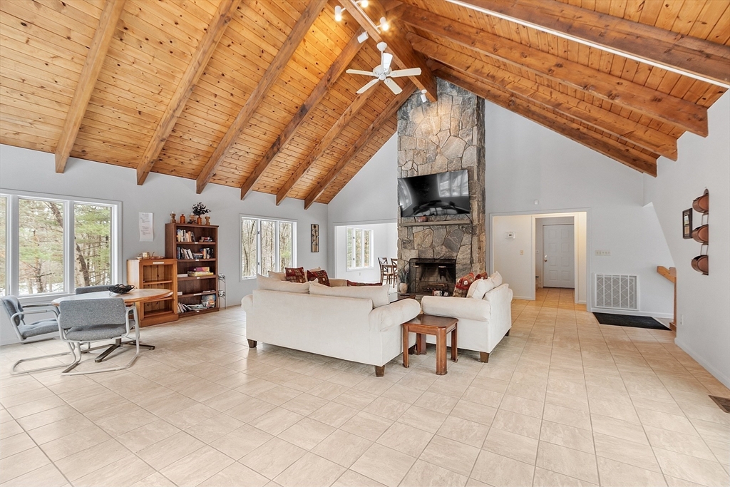 8 Deer Path, Unit 5 Maynard, MA 01754 - Photo 21 of 25 a living room with furniture and a fireplace