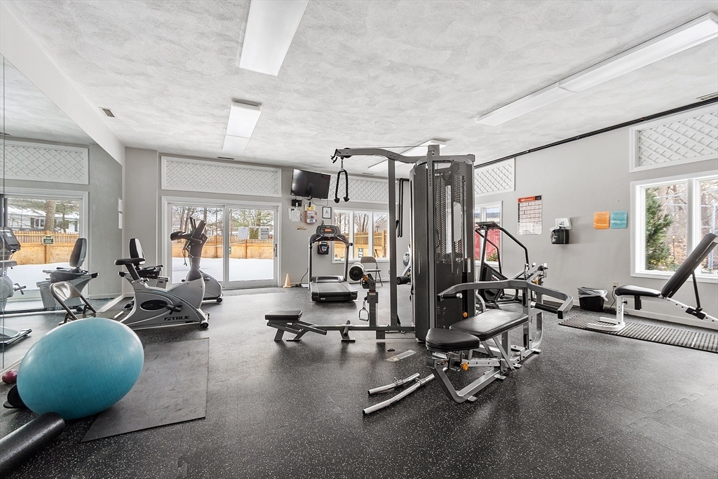 8 Deer Path, Unit 5 Maynard, MA 01754 - Photo 24 of 25 a view of a room with gym equipment