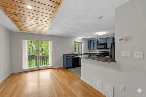 a kitchen with stainless steel appliances a refrigerator sink and stove