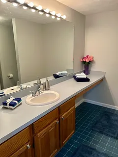 a bathroom with a sink and a mirror
