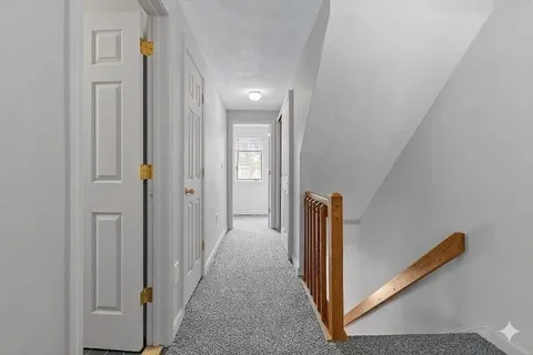 a view of hallway with stairs