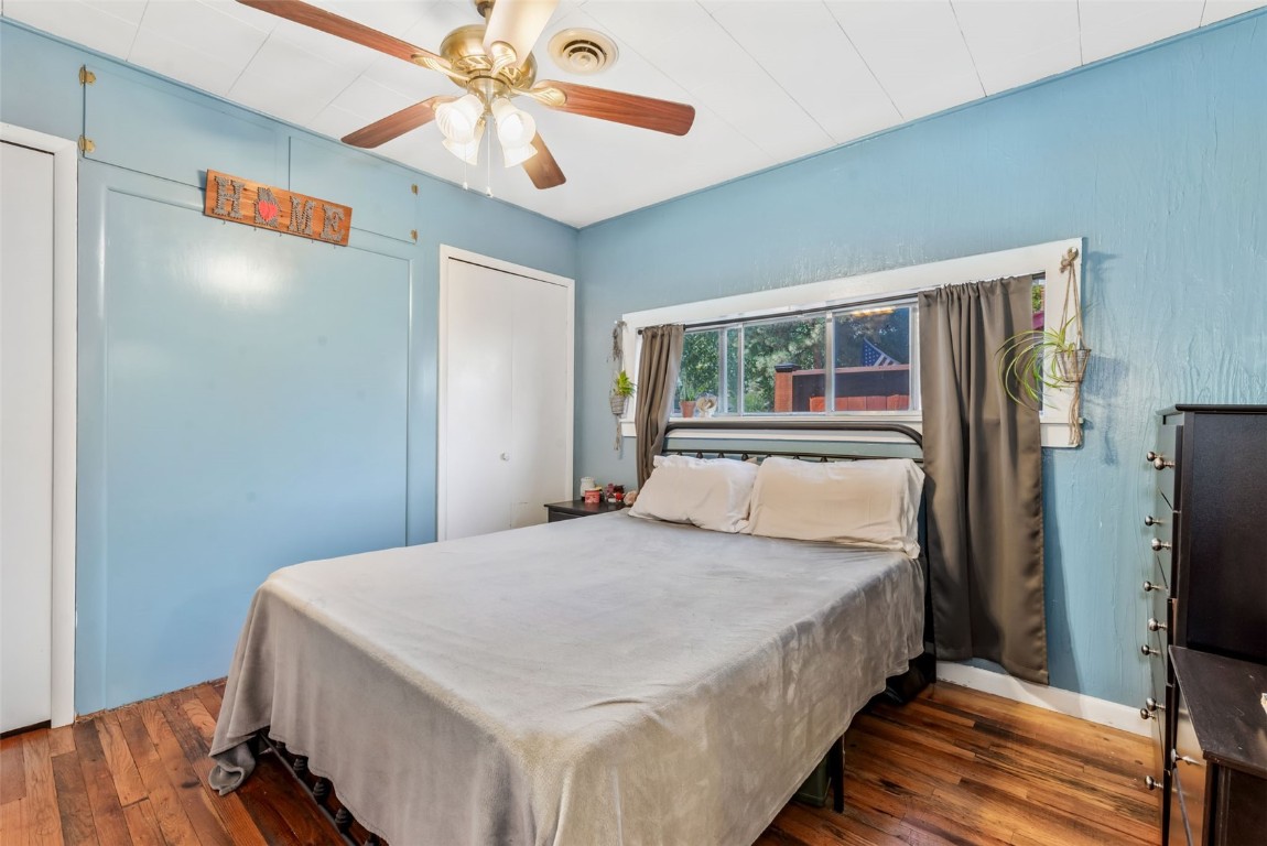 490 East Jefferson Avenue Hayden, CO 81639 - Photo 17 of 35 a bedroom with a large bed a flat tv screen and a walk in closet