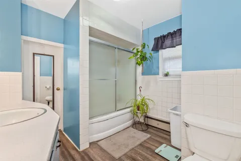 a bathroom with a tub and shower
