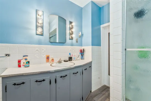 a bathroom with a sink and a mirror