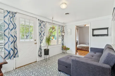 a living room with furniture and a window