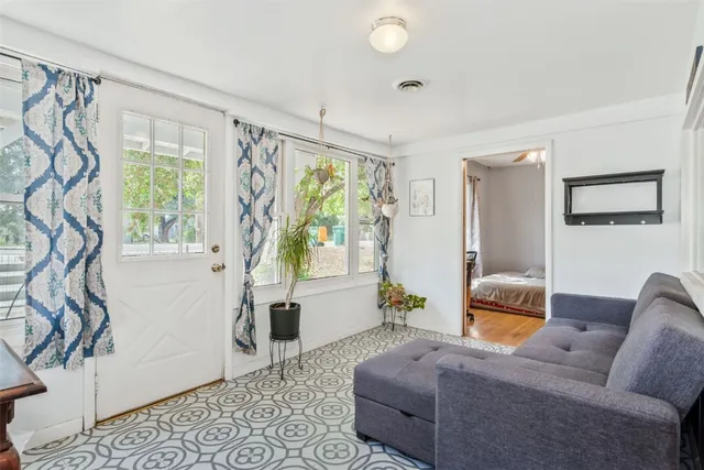 a living room with furniture and a window