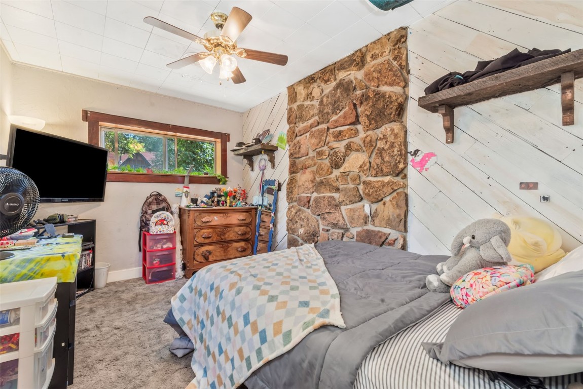 490 East Jefferson Avenue Hayden, CO 81639 - Photo 26 of 35 a bedroom with a bed and a flat screen tv