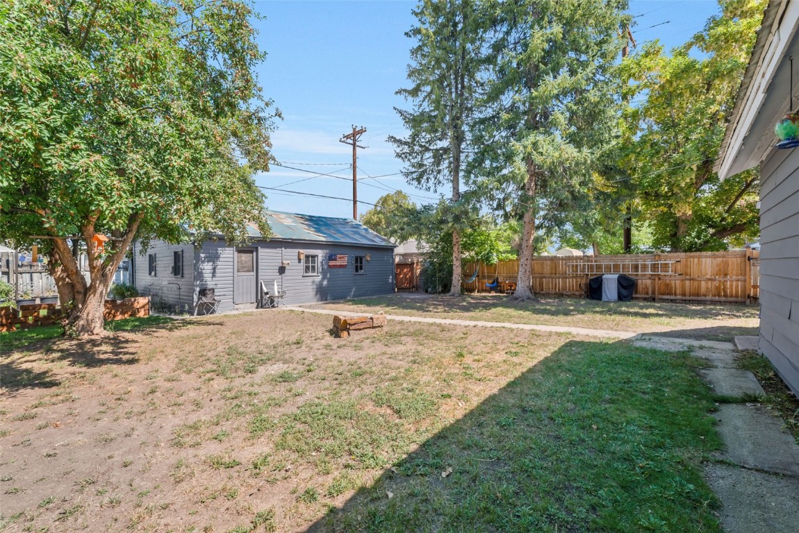 490 East Jefferson Avenue Hayden, CO 81639 - Photo 32 of 35 a view of a yard with a house and a large tree