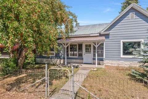 a house with trees in the background