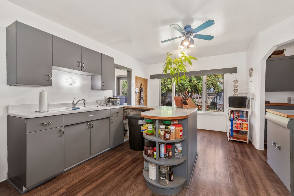 490 East Jefferson Avenue Hayden, CO 81639 - Photo 8 of 35 a kitchen with stainless steel appliances granite countertop a stove a refrigerator a sink dishwasher a dining table and chairs with wooden floor