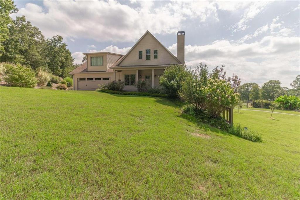 5309 Wild Smith Road Gainesville, GA 30506 - Photo 1 of 1 a front view of house with yard and green space