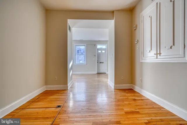 a kitchen with a stove a sink and a refrigerator