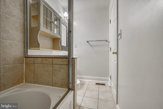 a view of a balcony with wooden floor