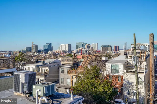 a front view of a residential apartment building with a yard