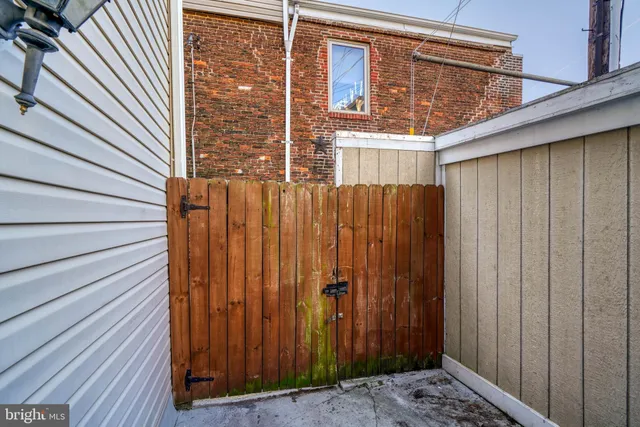 a view of a room with wooden chairs