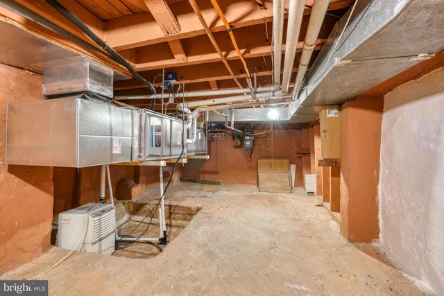 a view of a room with refrigerator and table