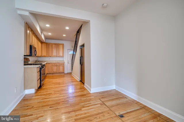 a kitchen with stainless steel appliances granite countertop a stove and a refrigerator