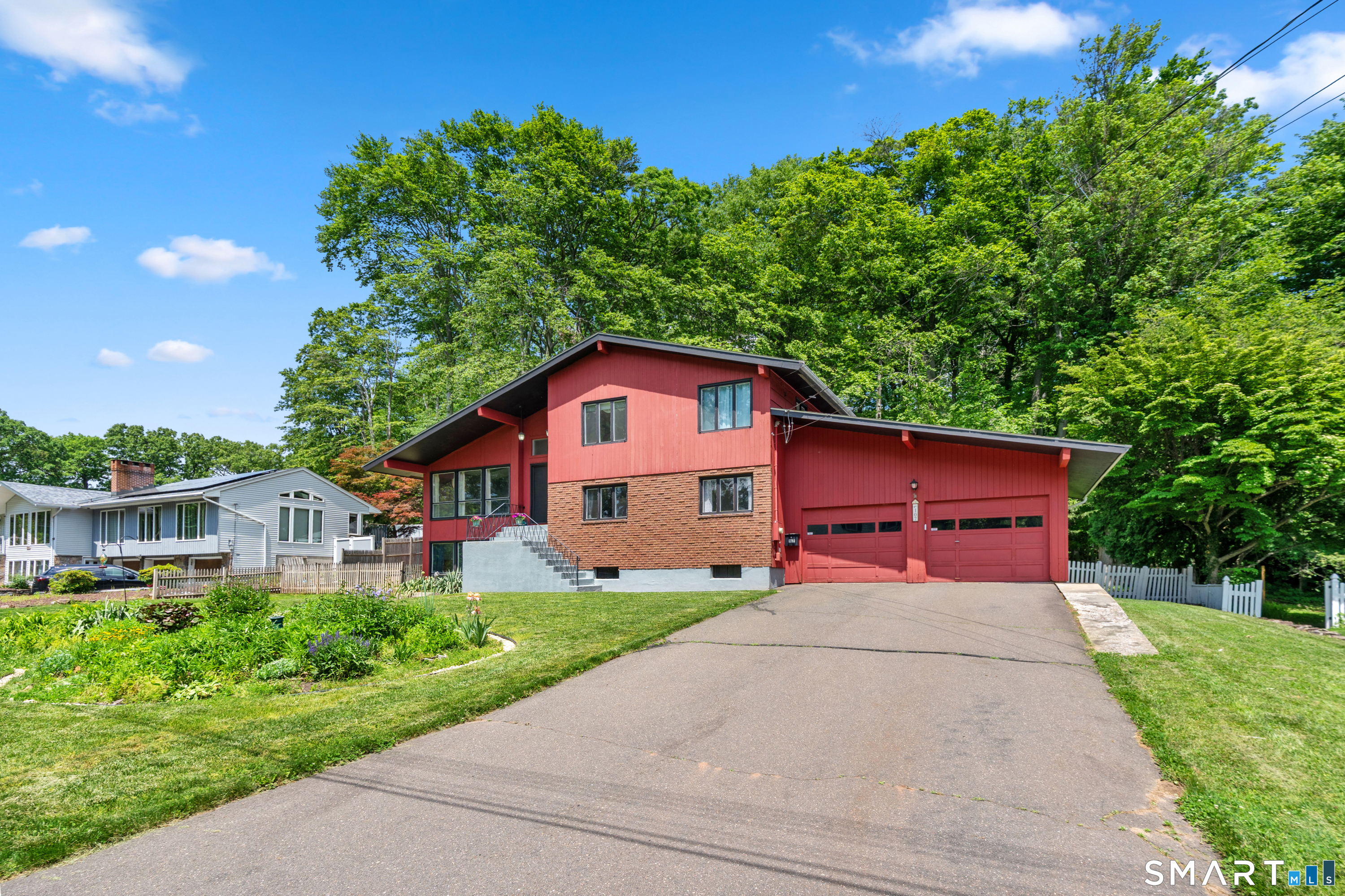 107 Round Hill Road Wethersfield, CT 06109 - Photo 3 of 40 a front view of a house with a yard and garage