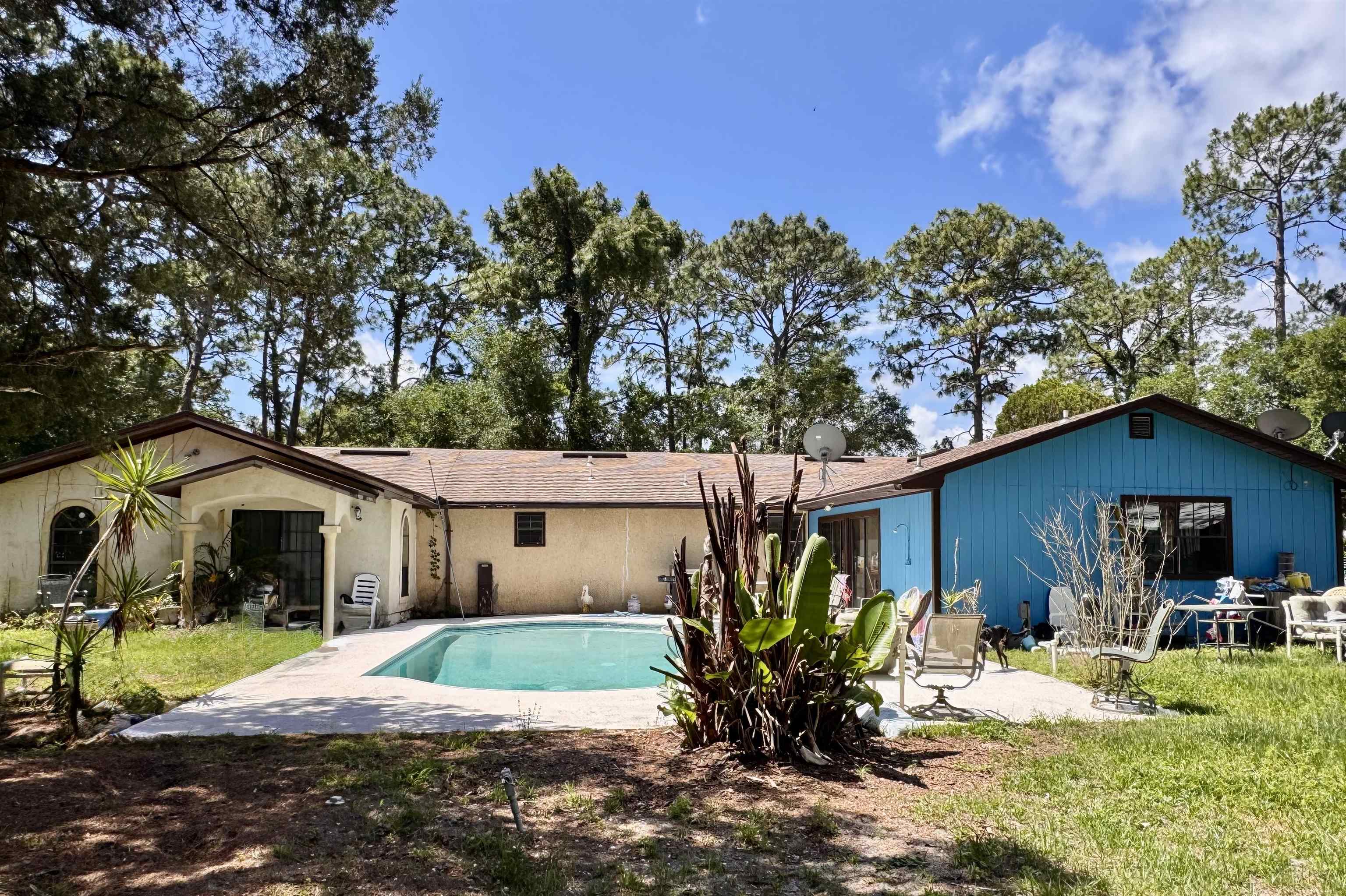 554 Hayley Road St. Augustine, FL 32086 - Photo 11 of 46 a house that has a tree in front of it