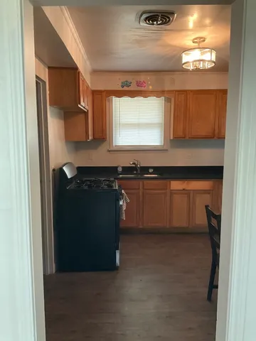 a kitchen with a sink and a window