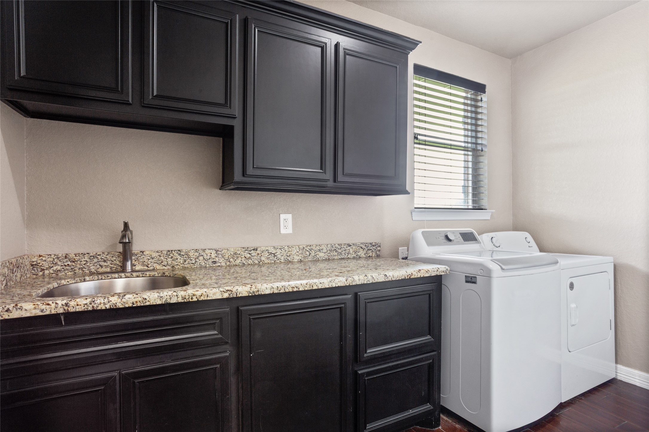 7842 Pebble Hill Lane Rosharon, TX 77583 - Photo 26 of 33 a kitchen with granite countertop cabinets stainless steel appliances and a sink