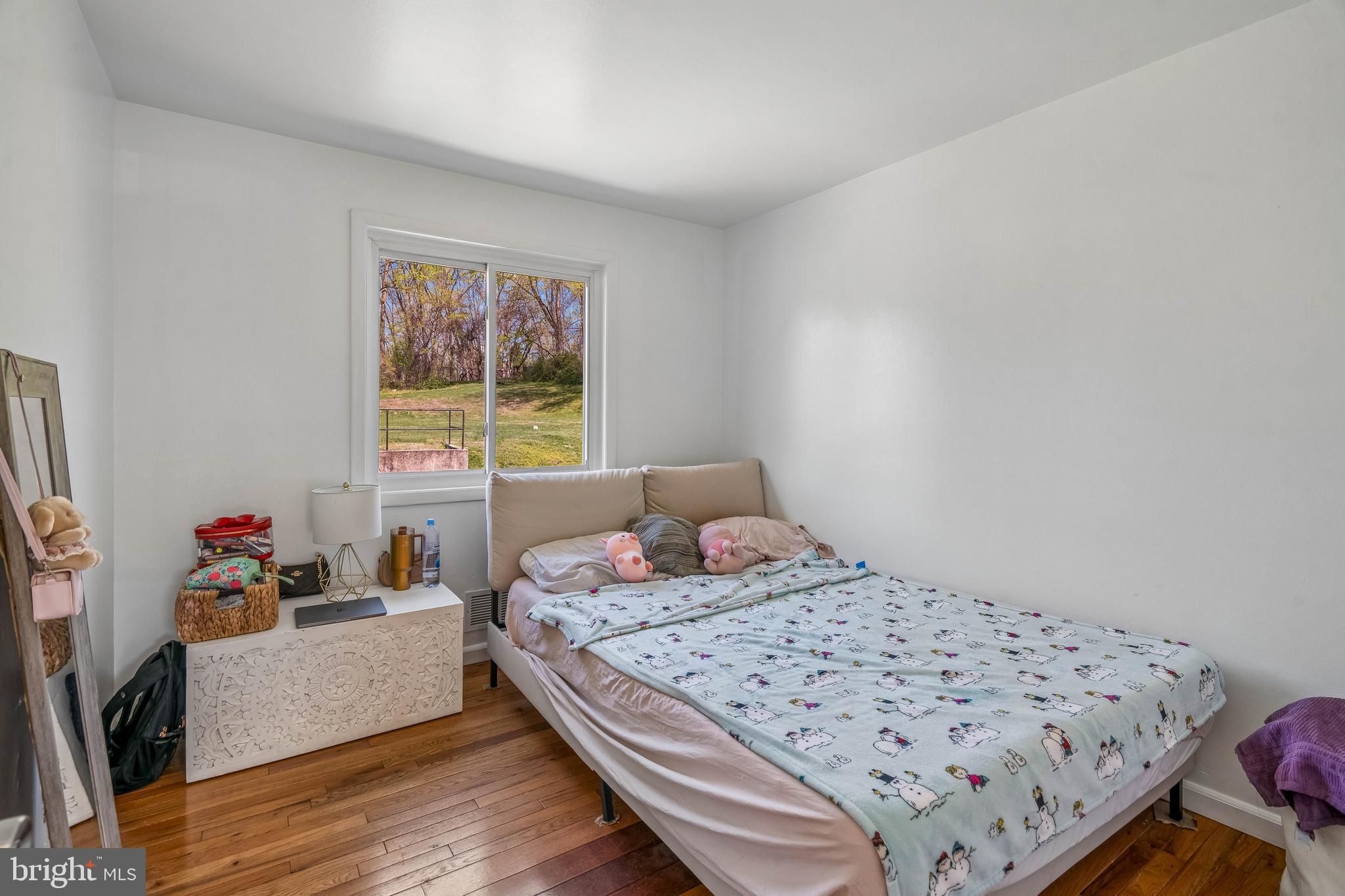 14418 Bel Pre Drive Silver Spring, MD 20906 - Photo 11 of 14 a bedroom with a bed and a window in it