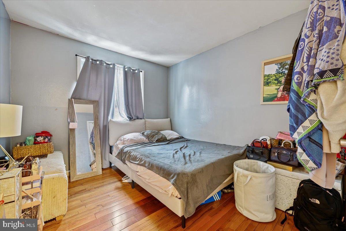 14418 Bel Pre Drive Silver Spring, MD 20906 - Photo 12 of 14 a bedroom with a bed and dresser