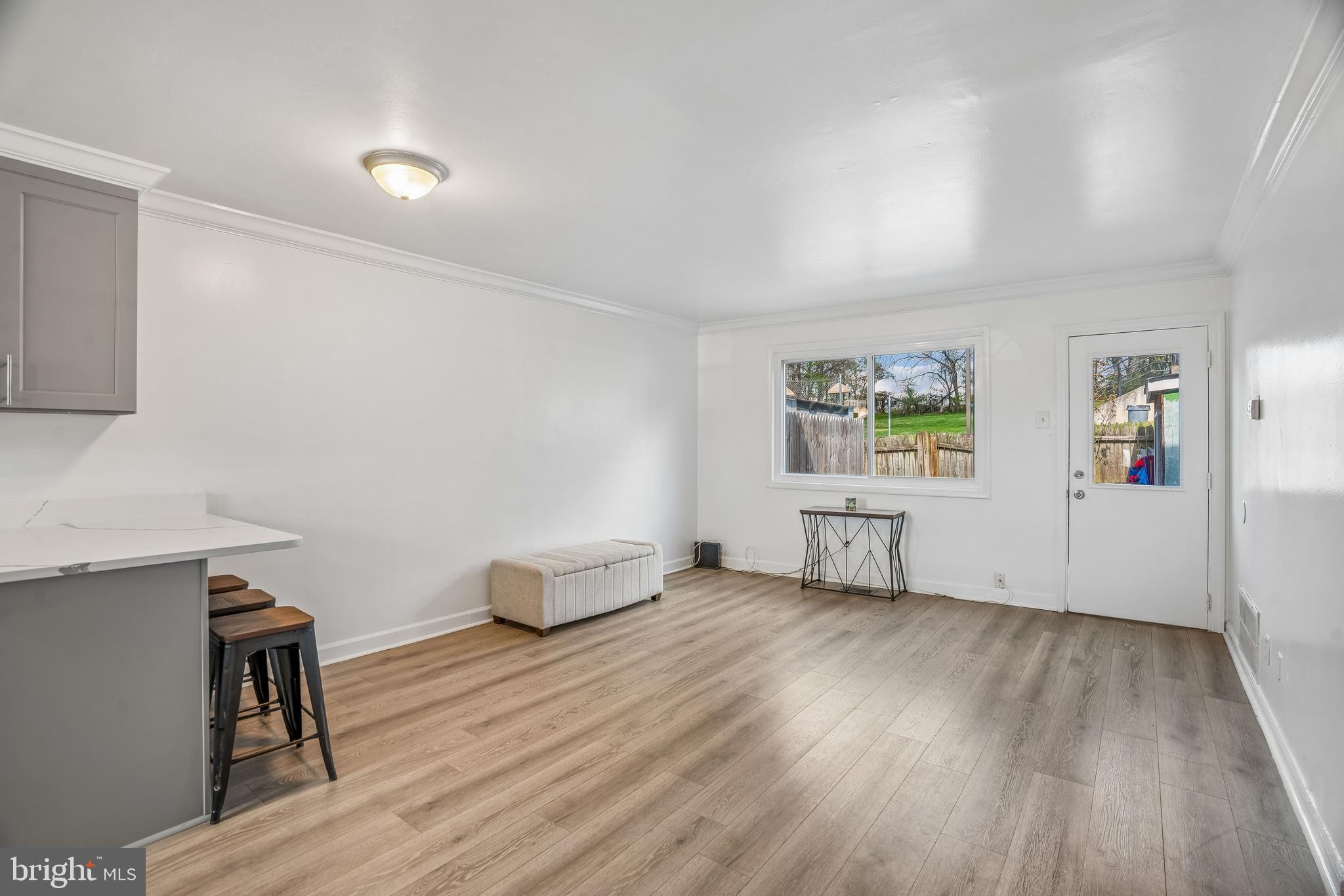 14418 Bel Pre Drive Silver Spring, MD 20906 - Photo 7 of 14 wooden floor in an empty room with a window