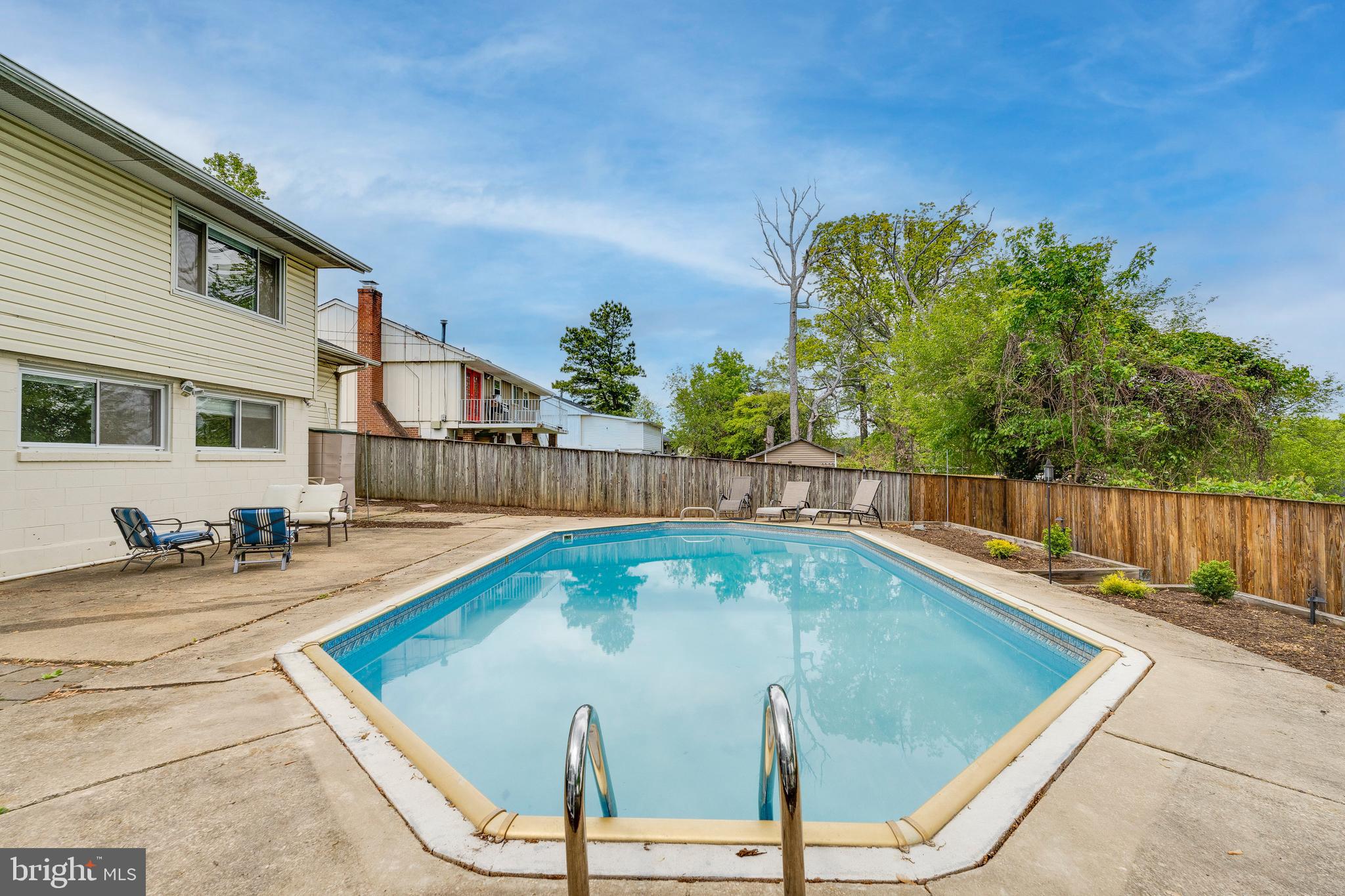 9210 Morley Road Lanham, MD 20706 - Photo 54 of 62 a view of a swimming pool with a lounge chairs