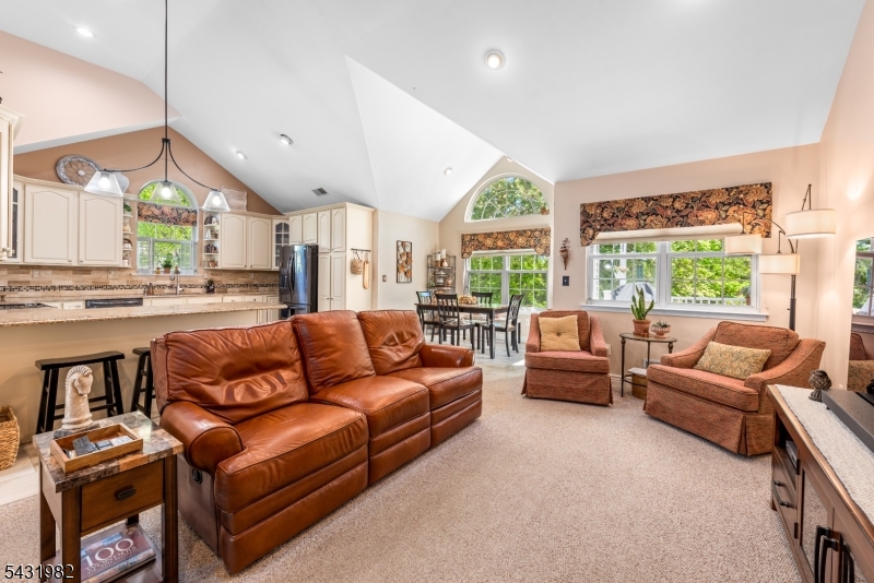 21 Towpath Lane Stanhope, NJ 07874 - Photo 11 of 37 a living room with furniture and a large window