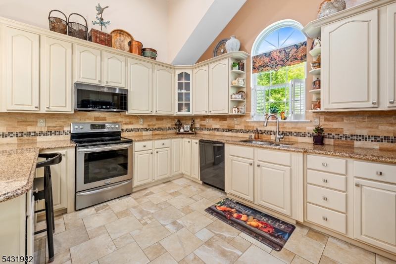 21 Towpath Lane Stanhope, NJ 07874 - Photo 13 of 37 a kitchen with a stove a sink and a microwave