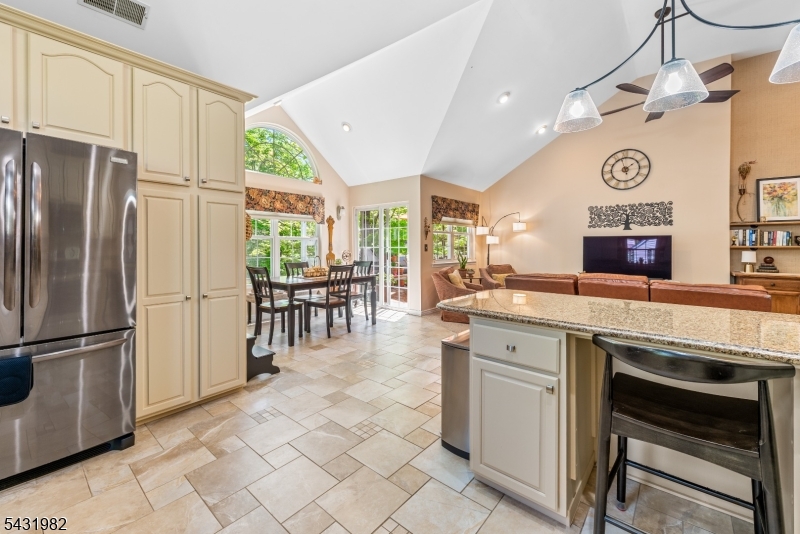 21 Towpath Lane Stanhope, NJ 07874 - Photo 14 of 37 a kitchen with stainless steel appliances granite countertop a refrigerator and a stove top oven