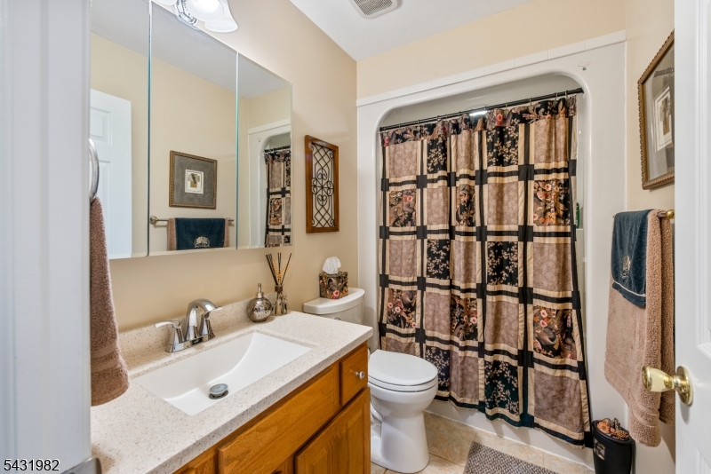 21 Towpath Lane Stanhope, NJ 07874 - Photo 16 of 37 a bathroom with a sink toilet and shower
