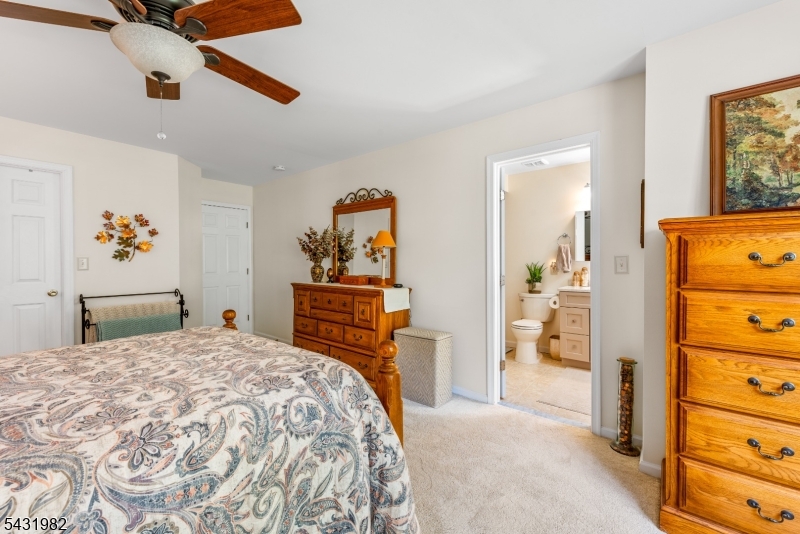 21 Towpath Lane Stanhope, NJ 07874 - Photo 19 of 37 a bedroom with a bed and a dresser