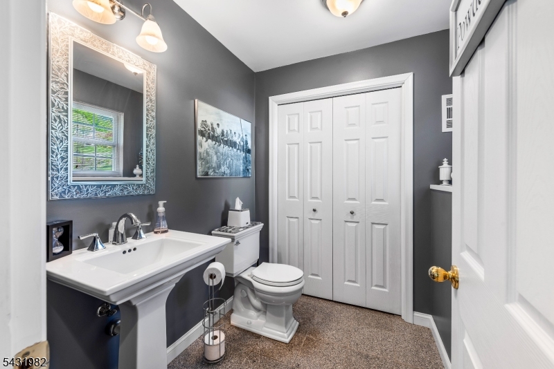 21 Towpath Lane Stanhope, NJ 07874 - Photo 21 of 37 a bathroom with a sink and a mirror