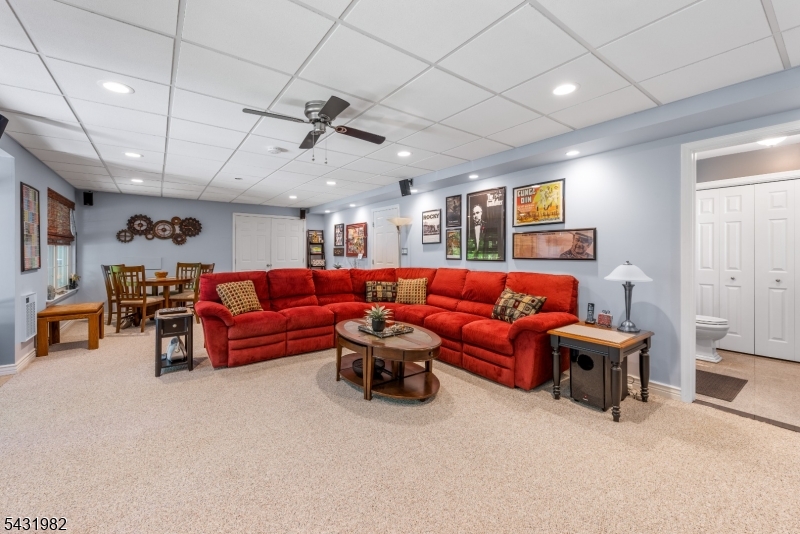 21 Towpath Lane Stanhope, NJ 07874 - Photo 23 of 37 a living room with furniture and a large window