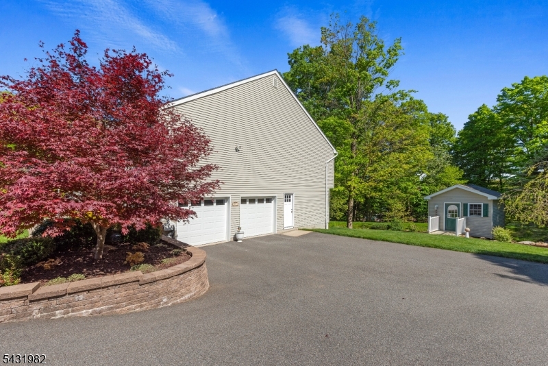 21 Towpath Lane Stanhope, NJ 07874 - Photo 31 of 37 a view of house with a outdoor space and potted plants