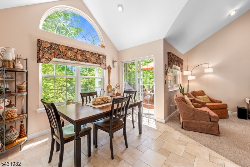 21 Towpath Lane Stanhope, NJ 07874 - Photo 9 of 37 a dining room with furniture and a floor to ceiling window