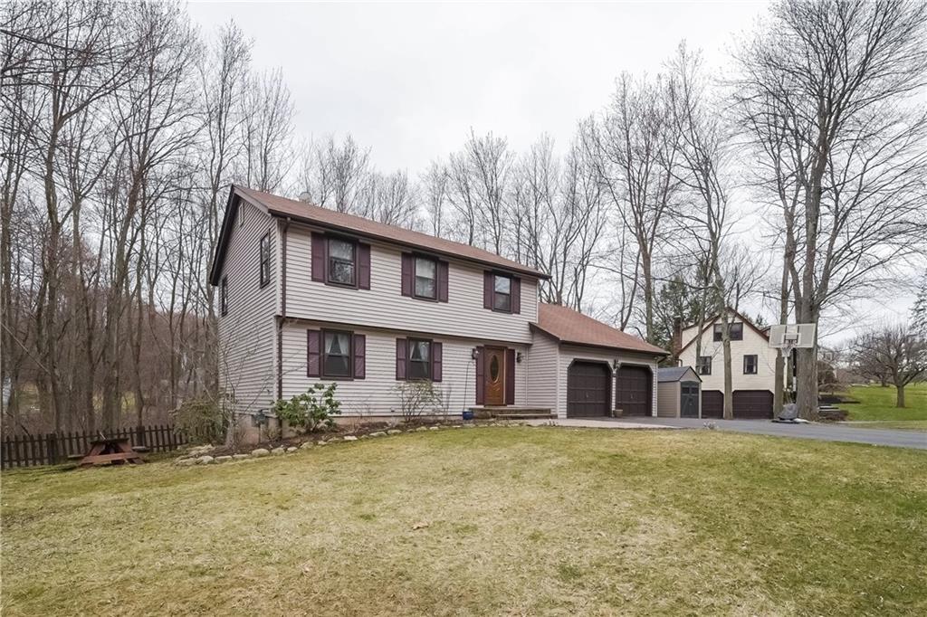 21 Adam Hill Road Windsor, CT 06095 - Photo 1 of 1 a front view of a house with a yard