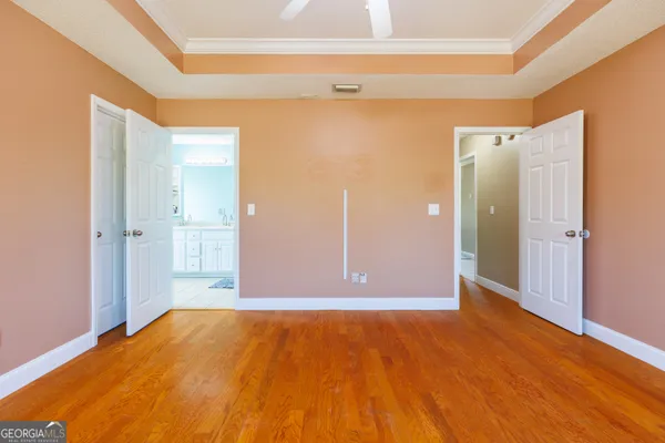 a view of a big room with wooden floor and closet