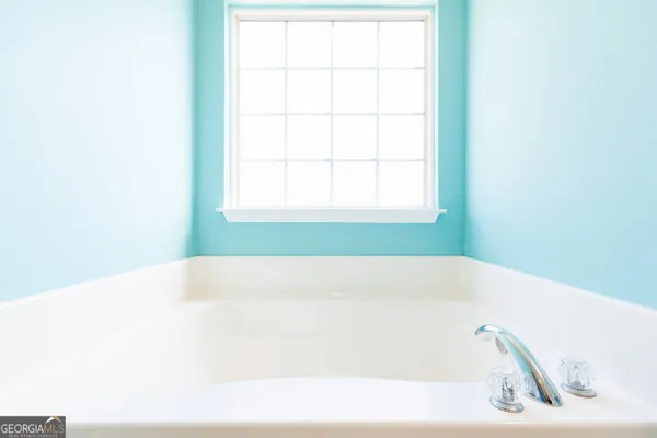 a bathroom with a bathtub